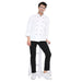 Unisex chef wearing a classic full sleeve chef coat with black accents, standing on a stool, showcasing style and functionality.