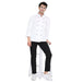Unisex chef wearing a classic full sleeve chef coat with black accents, standing on a stool, showcasing style and functionality.