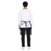 Back view of a man wearing a stylish Premium Leather Apron (Blue) with long ties, ideal for kitchen and bar use.