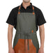 Premium green leather apron with big pocket, brass buckle and stylish back tie for versatile kitchen use.