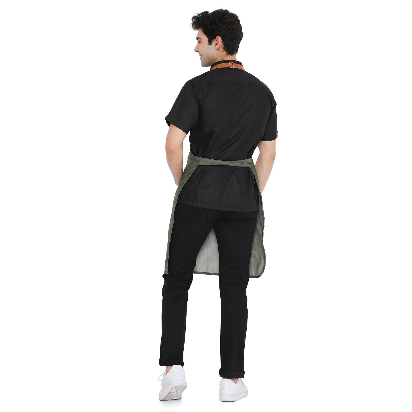 Back view of a man wearing a Premium Green Leather Apron with adjustable brass buckle, showcasing stylish design and durability.
