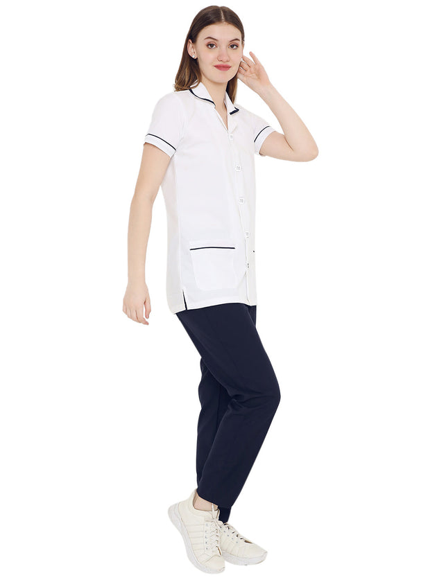 Women's half sleeve nurse apron coat and pant set in white and navy with pockets and premium fabric.