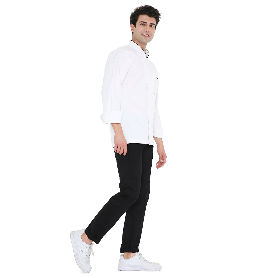 Model wearing Classic Full Sleeve Chef Coat in white with black accents, showcasing style and comfort for culinary professionals.