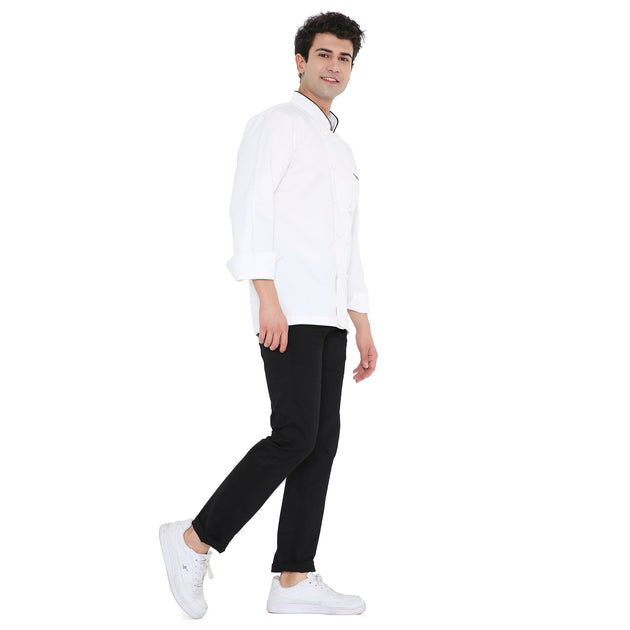 Model wearing Classic Full Sleeve Chef Coat in white with black accents, showcasing style and comfort for culinary professionals.