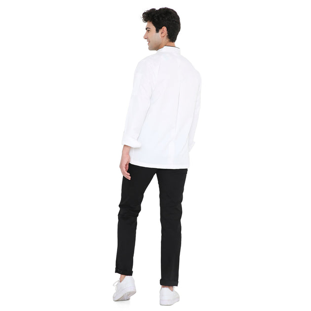 Model wearing a Classic Full Sleeve Chef Coat in white, showcasing the back design with black pants and white shoes.
