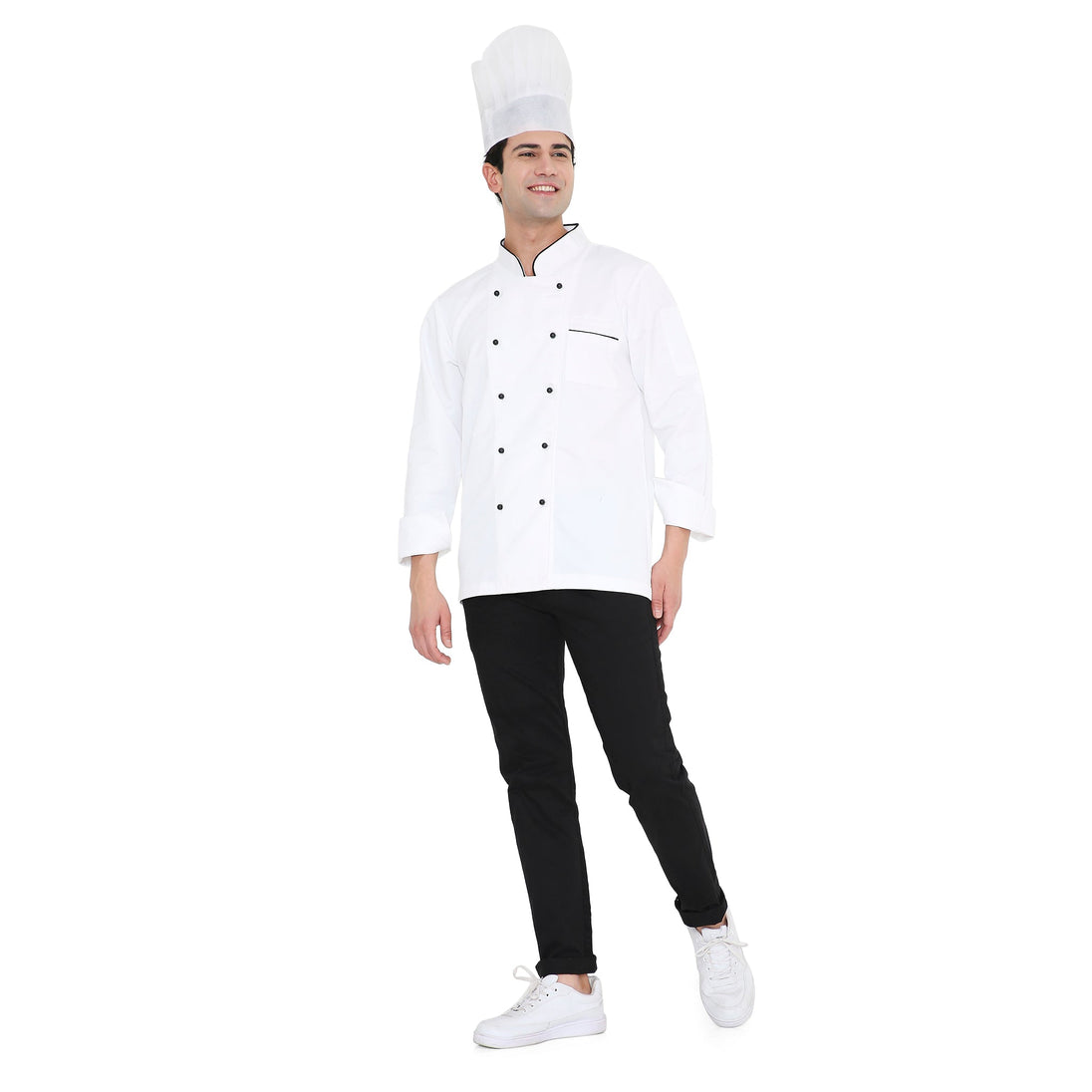 Male chef wearing a classic white chef coat with black accents and a chef hat, showcasing professional culinary attire.