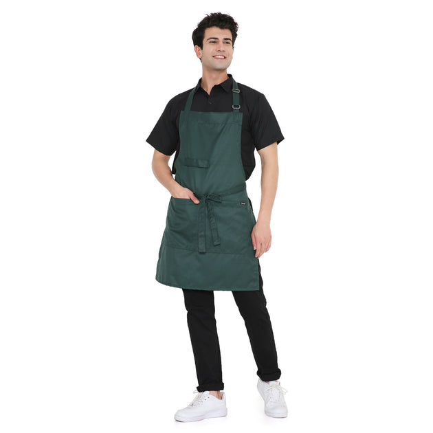 Man wearing a dark green classic kitchen apron with pockets and adjustable neck strap, ideal for cooking and multiple uses.