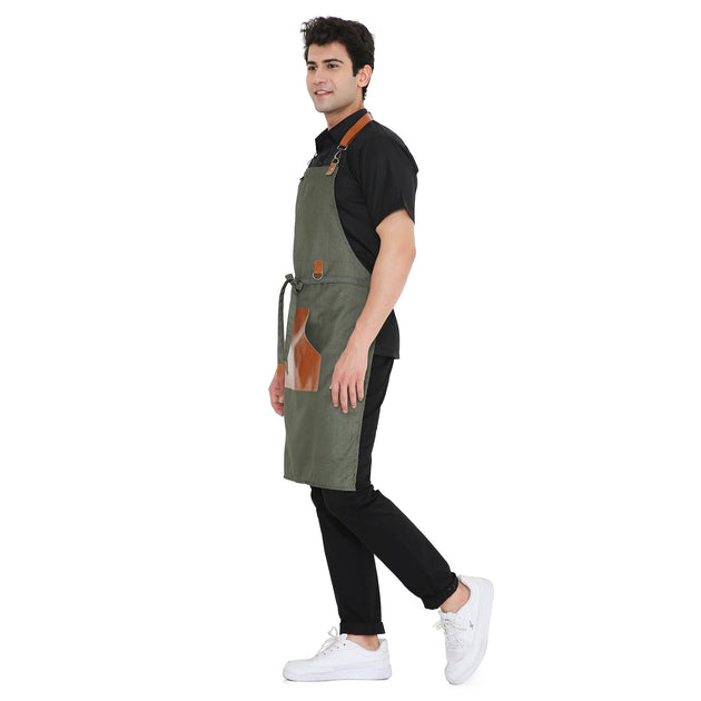 Premium green leatherette apron with brass buckles, big pocket, and stylish design for kitchen and café use.