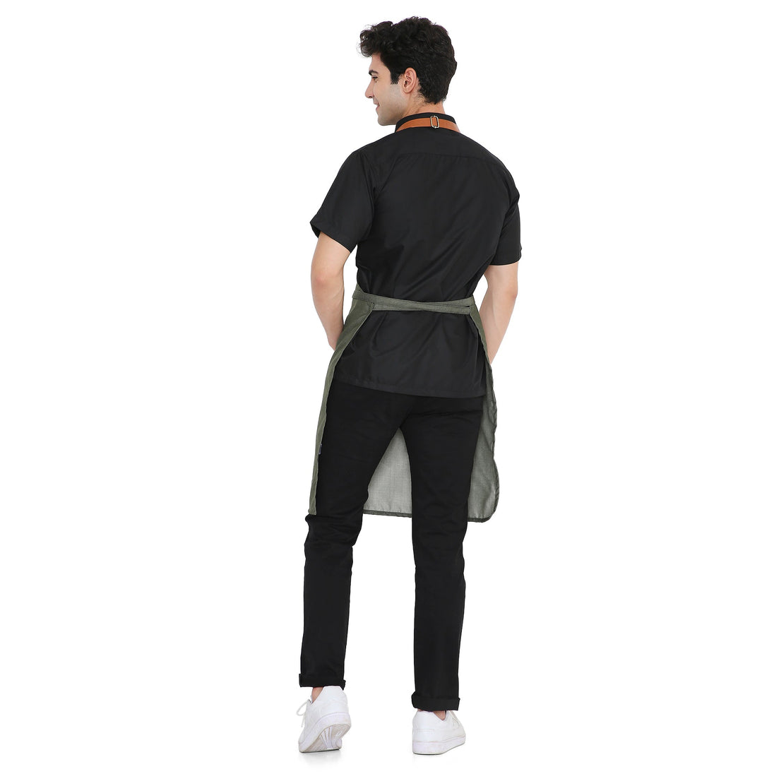 Back view of a man wearing a Premium Green Leather Apron with adjustable brass buckle, showcasing stylish design and durability.