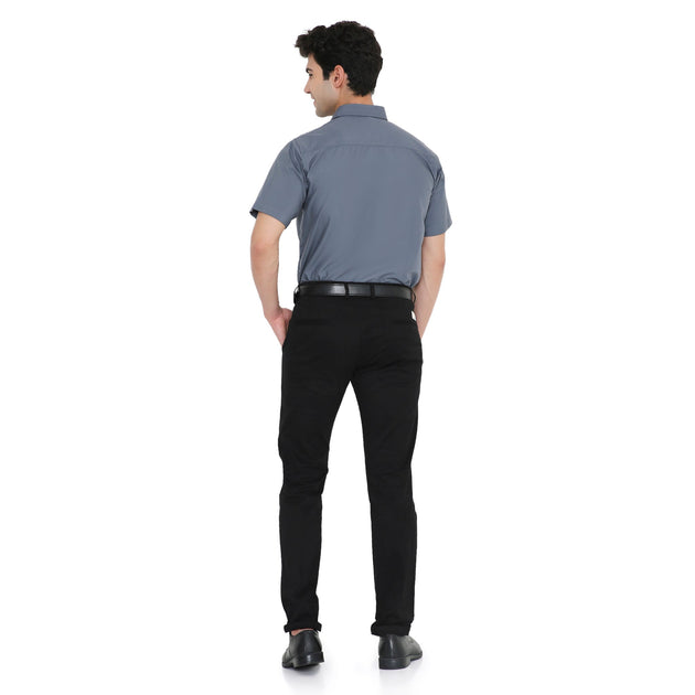 Back view of a man wearing a men's half sleeve shirt, perfect for workwear with high-quality fabric and slim fit.