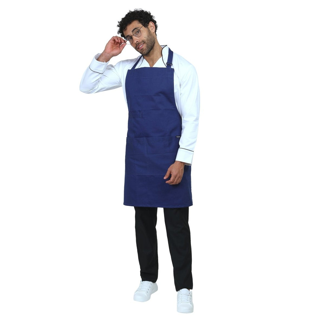 Blue apron front pocket detail — deep storage for kitchen tools