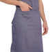 Grey bib apron flat lay — adjustable neck strap and waist tie