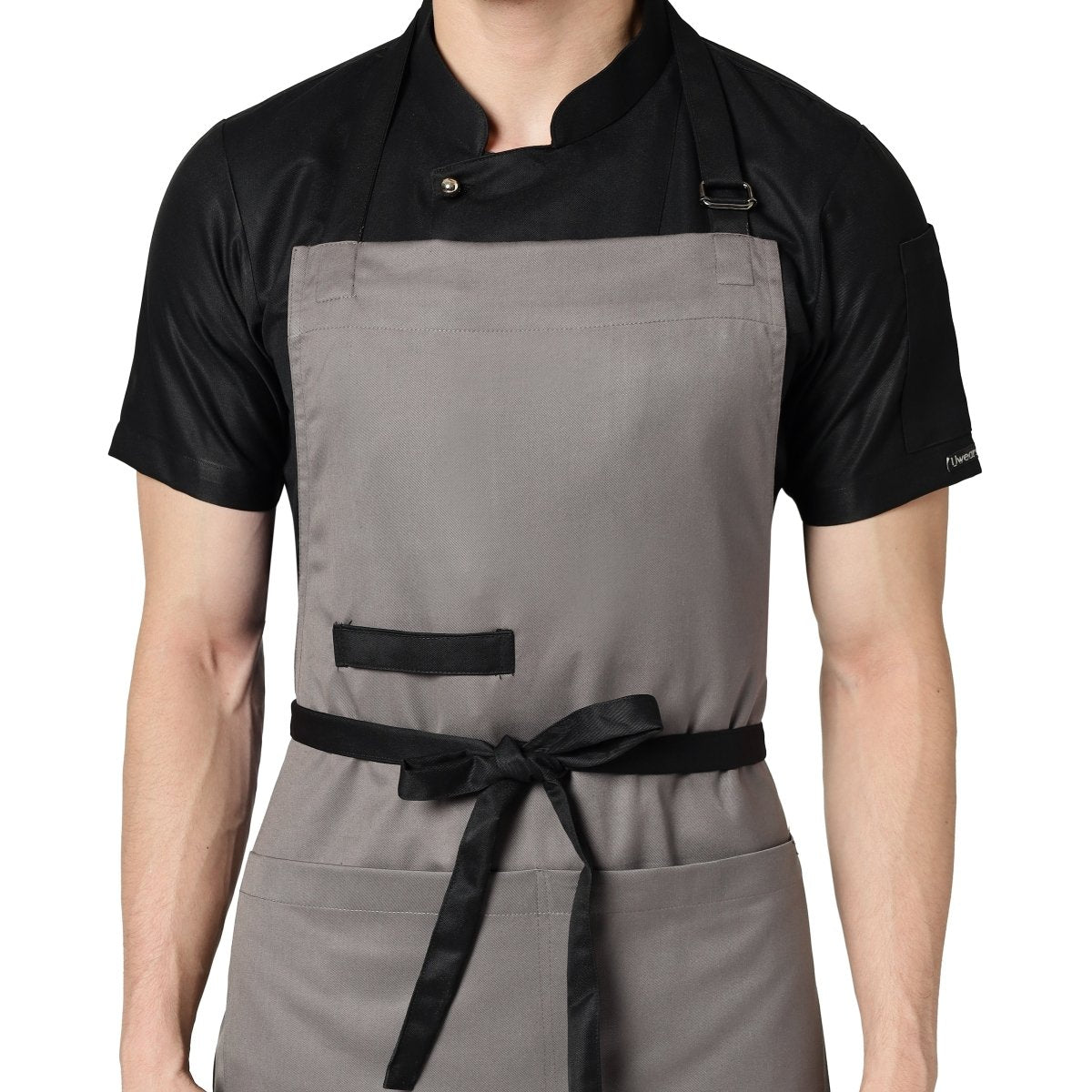 Grey black kitchen apron on model — restaurant and cafe uniform India
