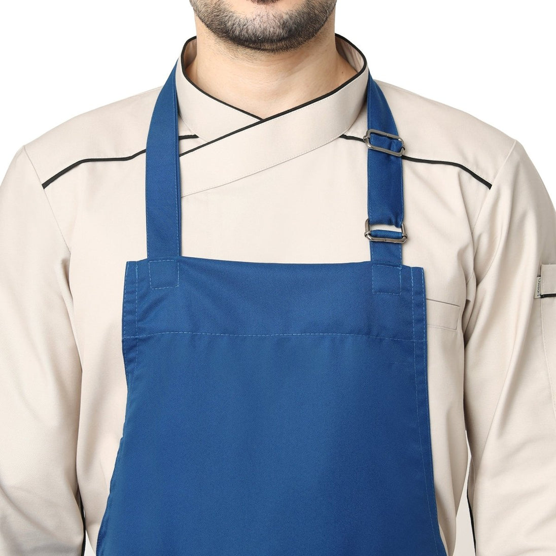Royal blue bib apron flat lay — adjustable neck strap and waist tie