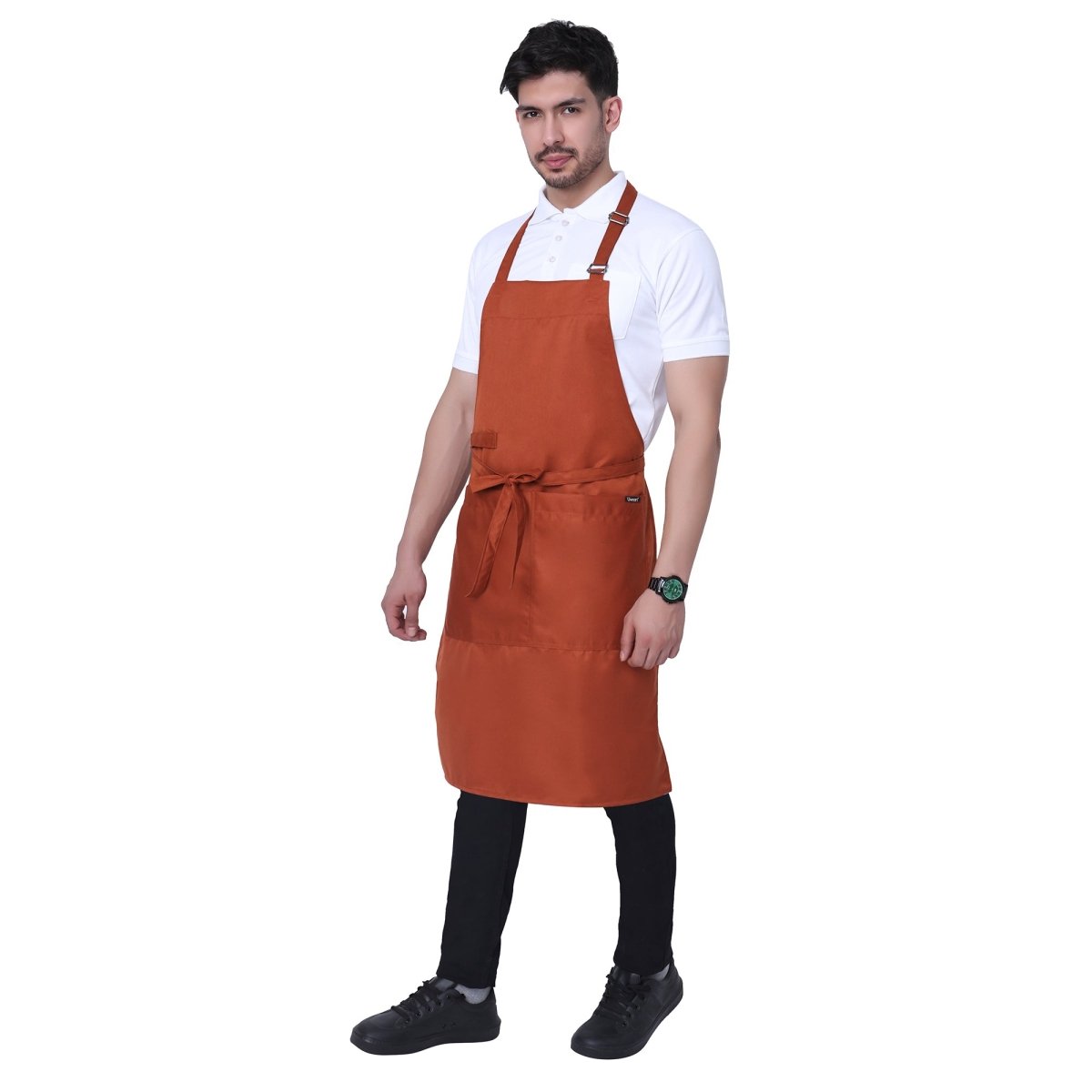 Rust orange bib apron flat lay — adjustable neck strap and waist tie