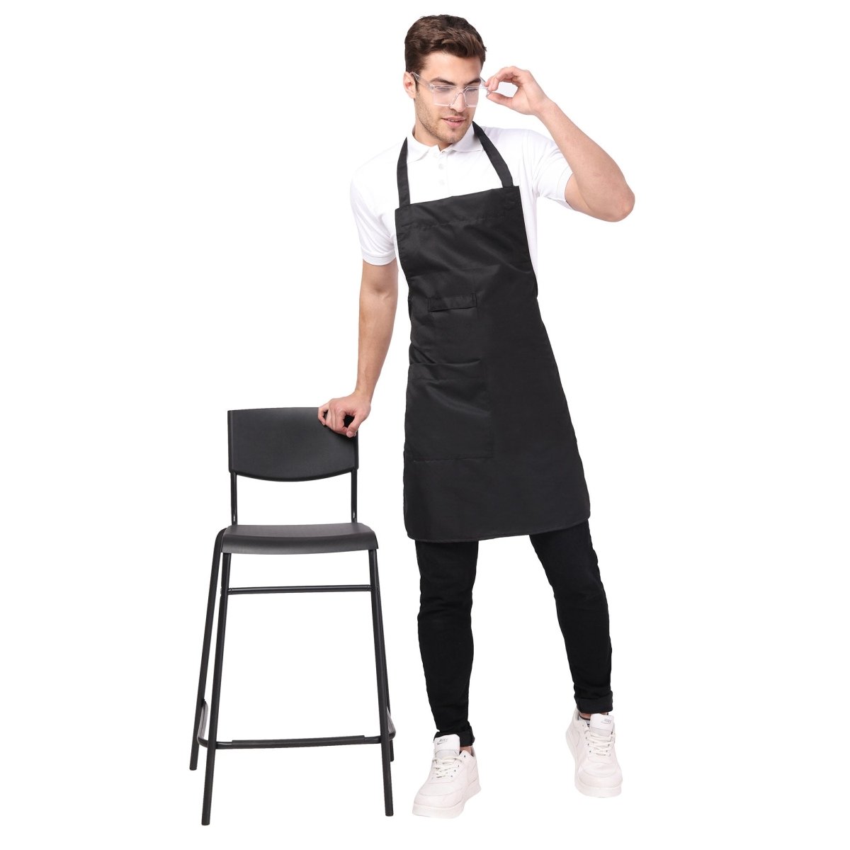 Pack of 4 black aprons on model — hotel and restaurant staff uniform bulk order