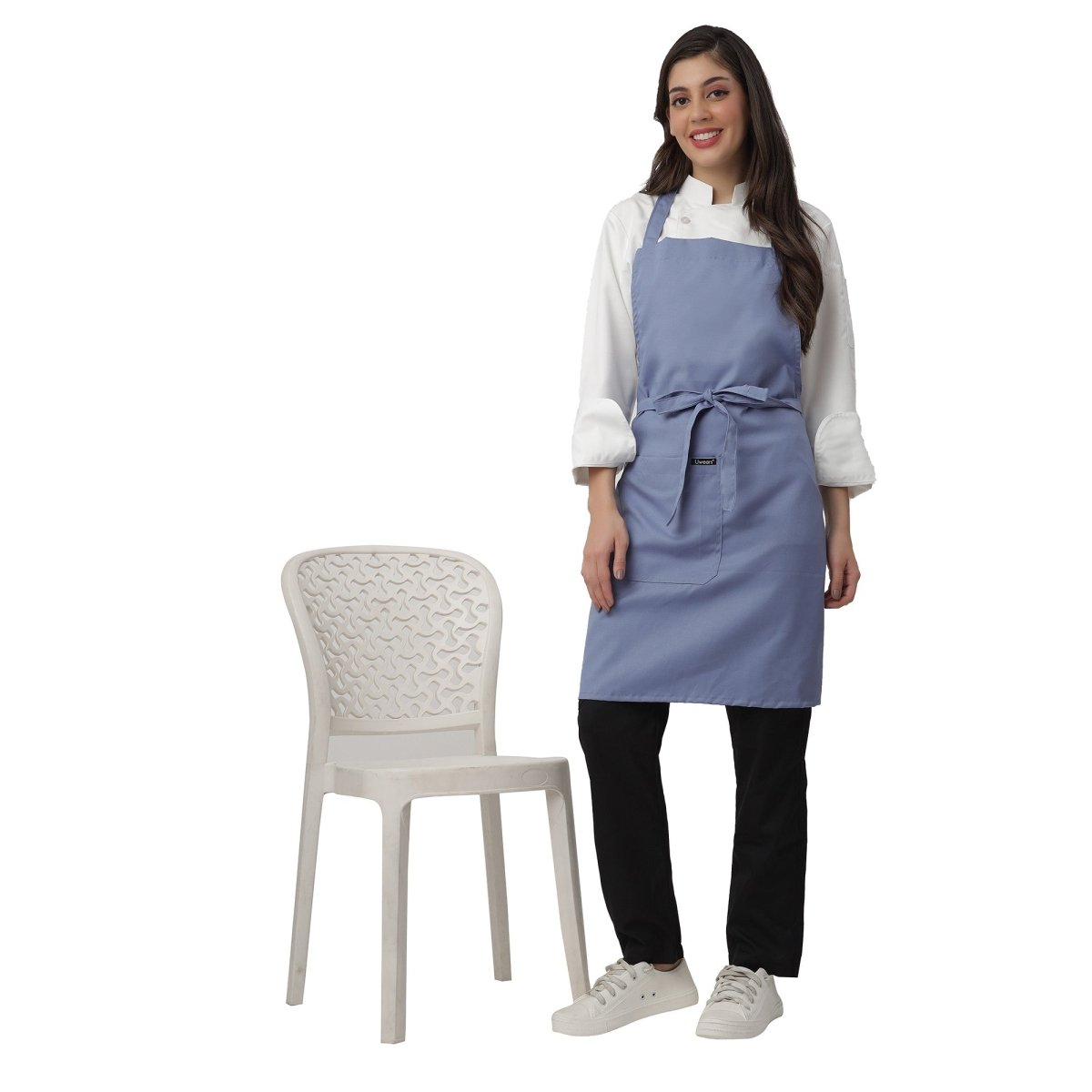 Ceil blue apron pocket detail — deep front pocket for kitchen staff