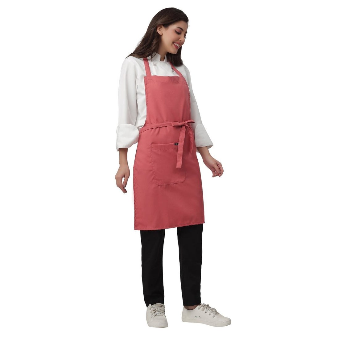 Coral pink apron pocket detail — deep front pocket for kitchen staff