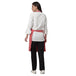 Pack of 4 coral pink aprons on model — restaurant and cafe uniform