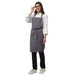 Set of 4 grey aprons laid out — bulk order free logo printing