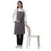 Pack of 4 grey aprons on model — hotel and cafe staff uniform