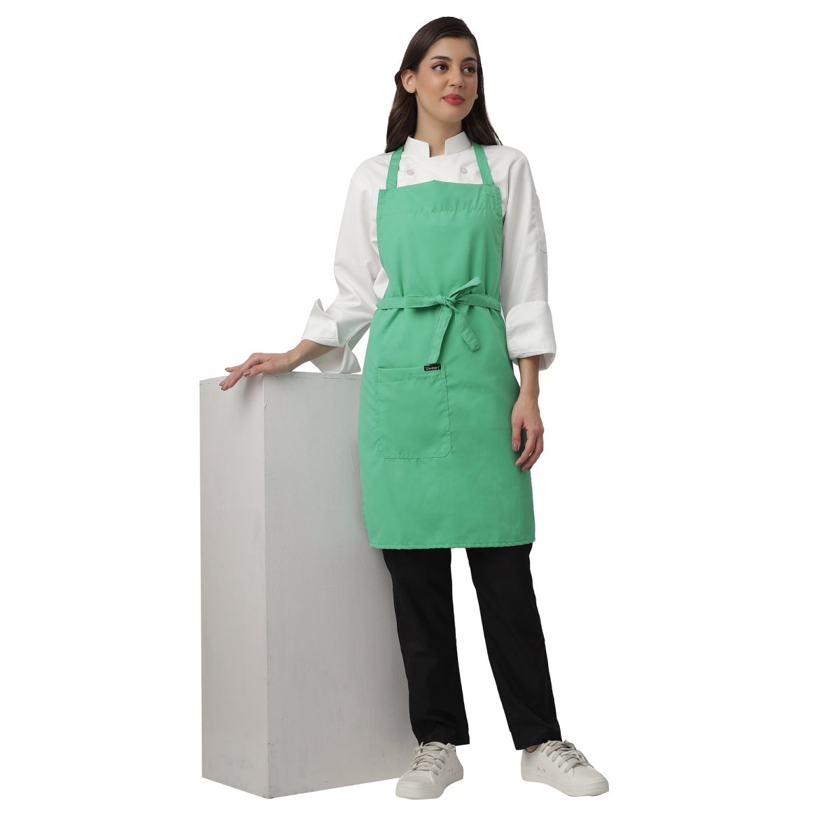 Pack of 4 light green aprons on model — restaurant and cafe uniform