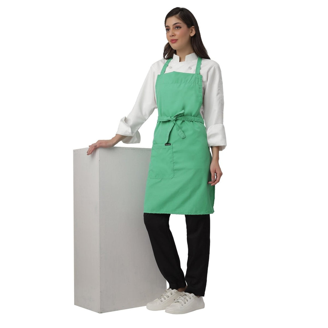 Custom logo on light green kitchen aprons — free embroidery bulk order India