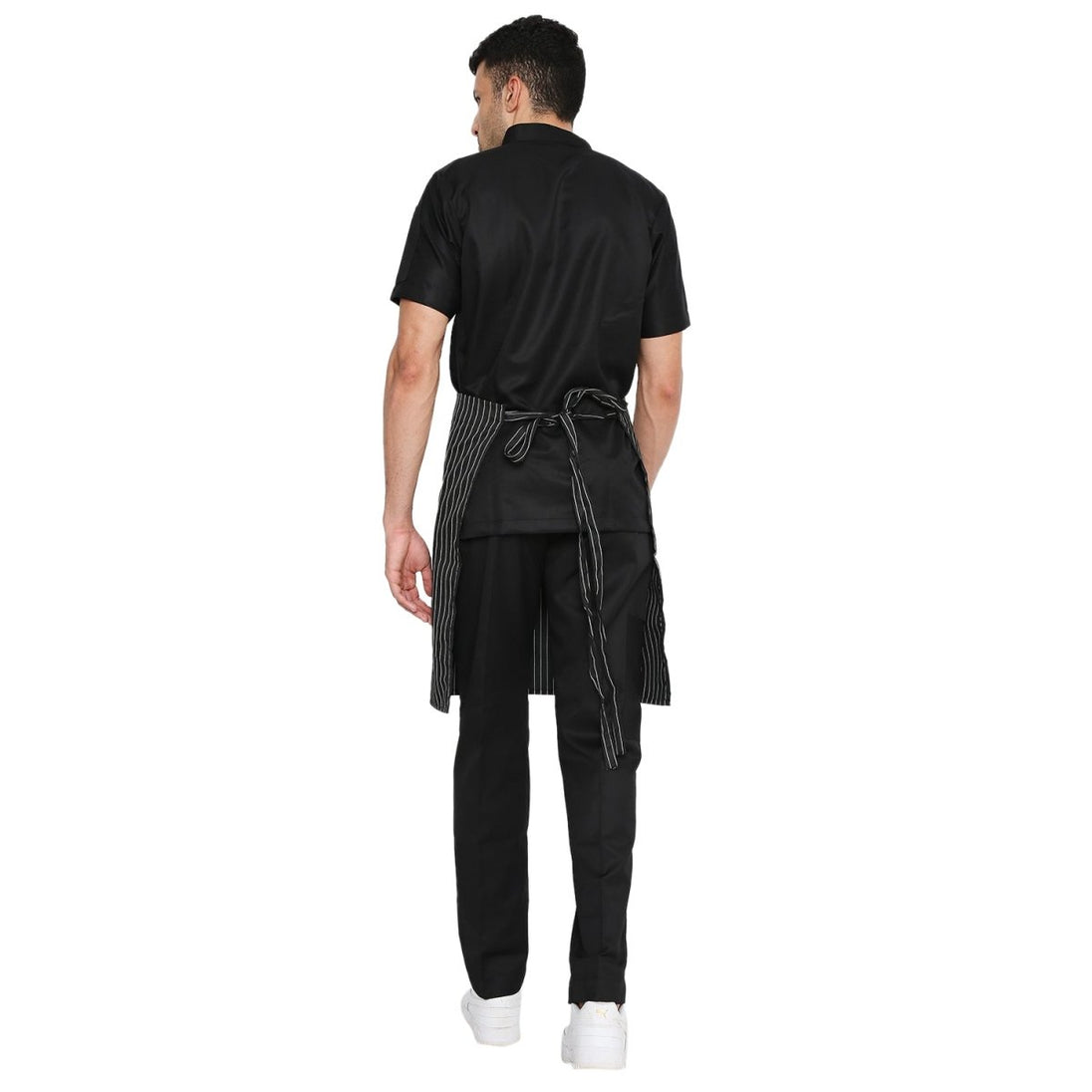 Pack of 4 black white service aprons on model — restaurant uniform India