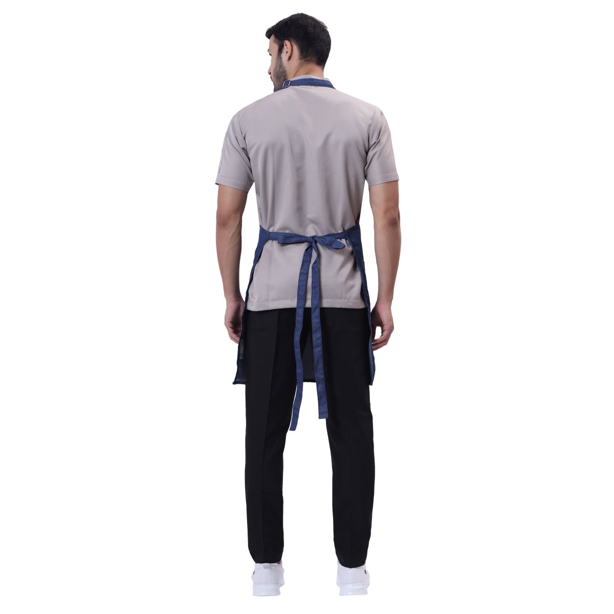 Blue denim apron front pocket detail — deep storage for kitchen tools