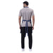 Blue denim apron front pocket detail — deep storage for kitchen tools