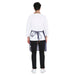 Blue leather apron pocket detail — spacious front pocket